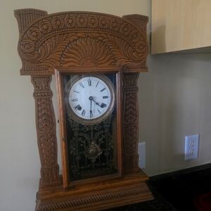 Vintage Wooden Wall Clock with Intricate Carvings